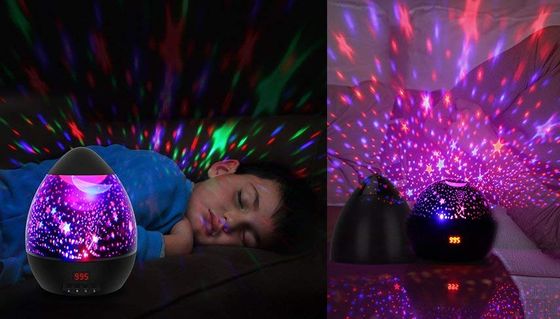 Night Light Projector With Blue Stars On Wall