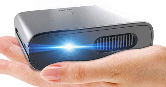Small Pocket Projector In Womans Hand