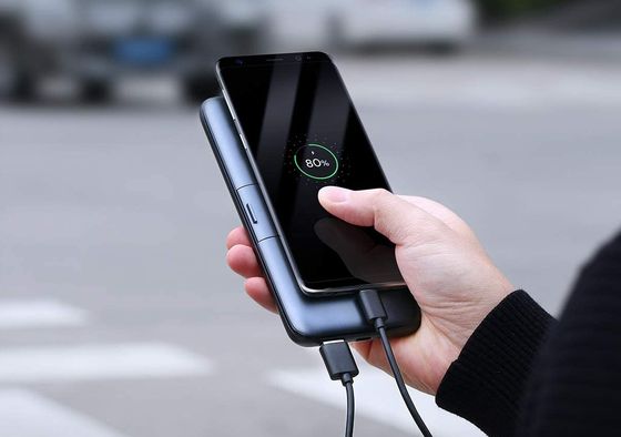 Portable Charger In Mans Hand