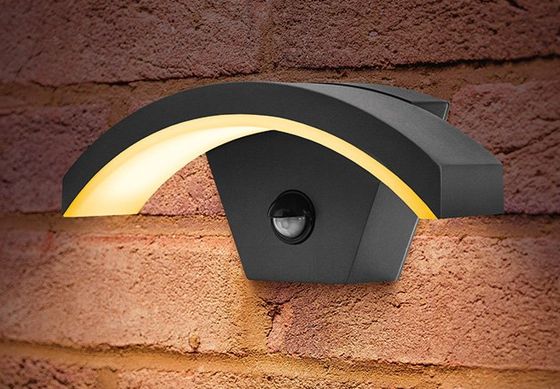 Curved External Bulkhead Light On Brick Wall