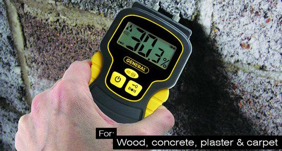 Meter Held Against The Wood Black And Yellow Damp Meter