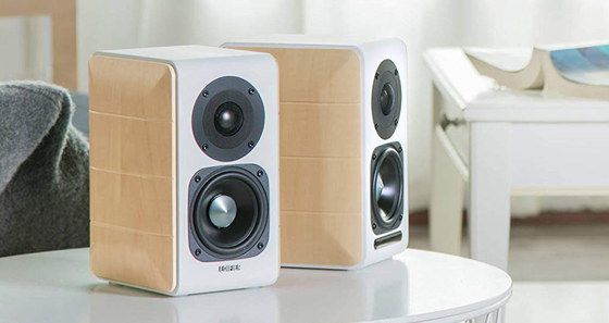 White Bookshelf Speakers On Table