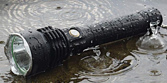 Black LED Hand-Held Torch In Pond