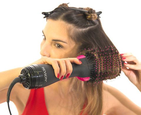 Get The Revlon Styler Now Black Styler Volumiser In Womans Hand