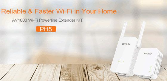 Tenda Plug In WiFi Extender Kit Plug In WiFi Extender In White On Wood Desk
