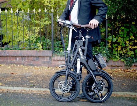 Fold Up Electric Bike Carried By Man