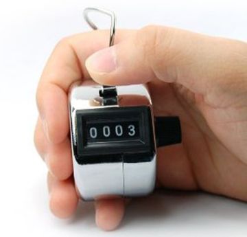 Hand-Held Digital Tally Counter In Man's Hand